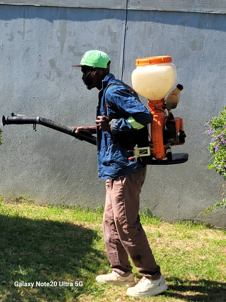 Technician with Motorized Blower